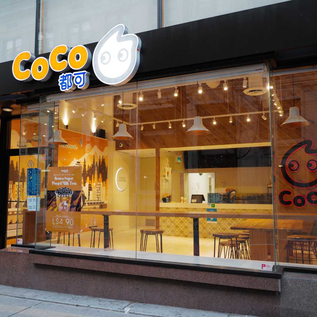 A CoCo bubble tea franchise shop with a poster of brown sugar pearl milk tea.